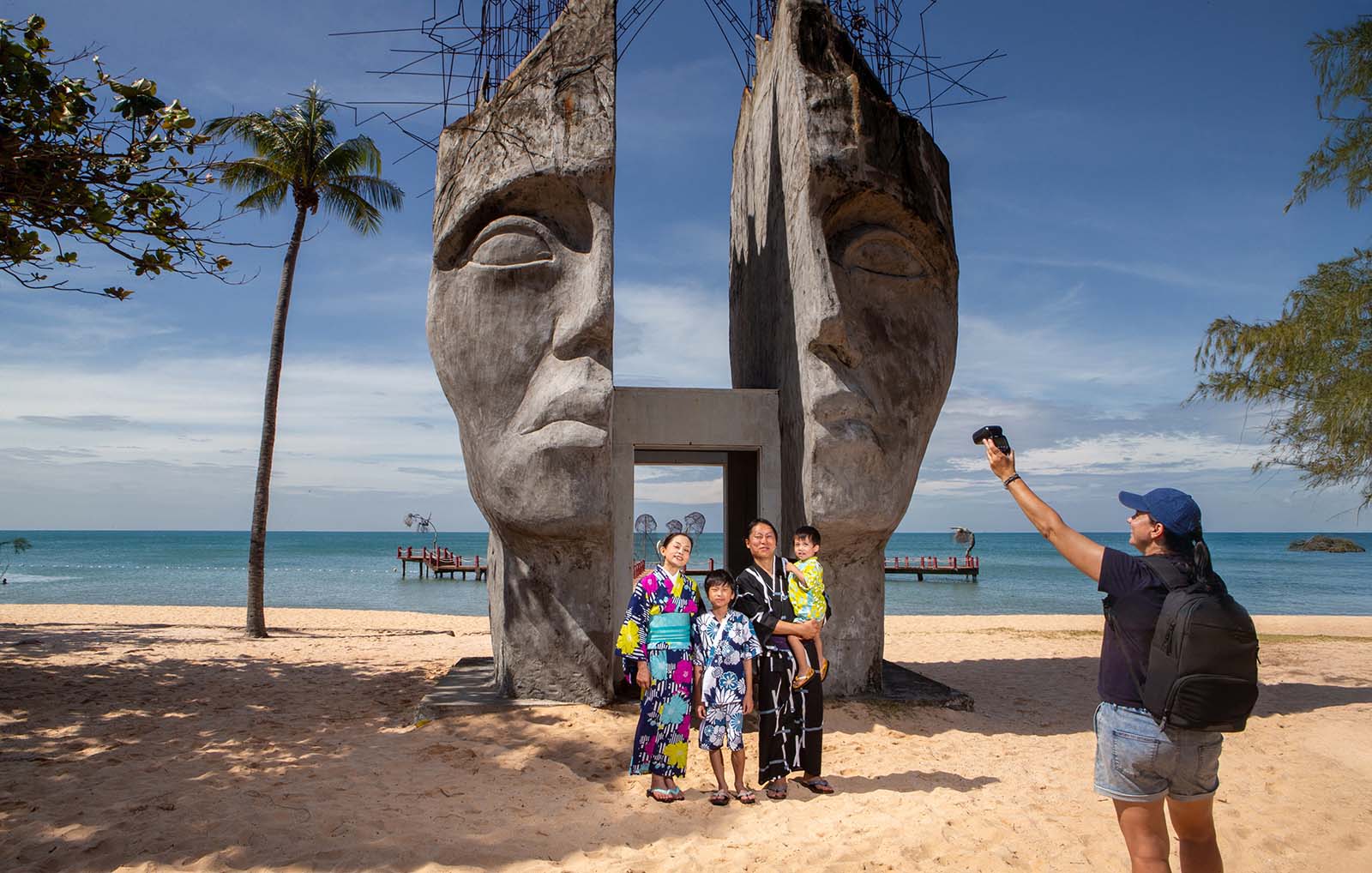 Kids play by the sea at Sunset Sanato beach